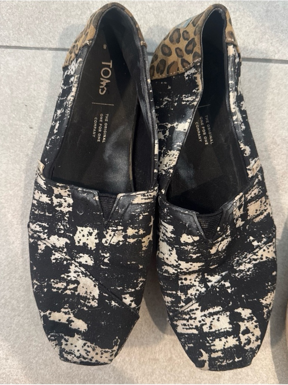 Toms Black and Cream Patterned Canvas Slip-Ons with Leopard Heel Accent